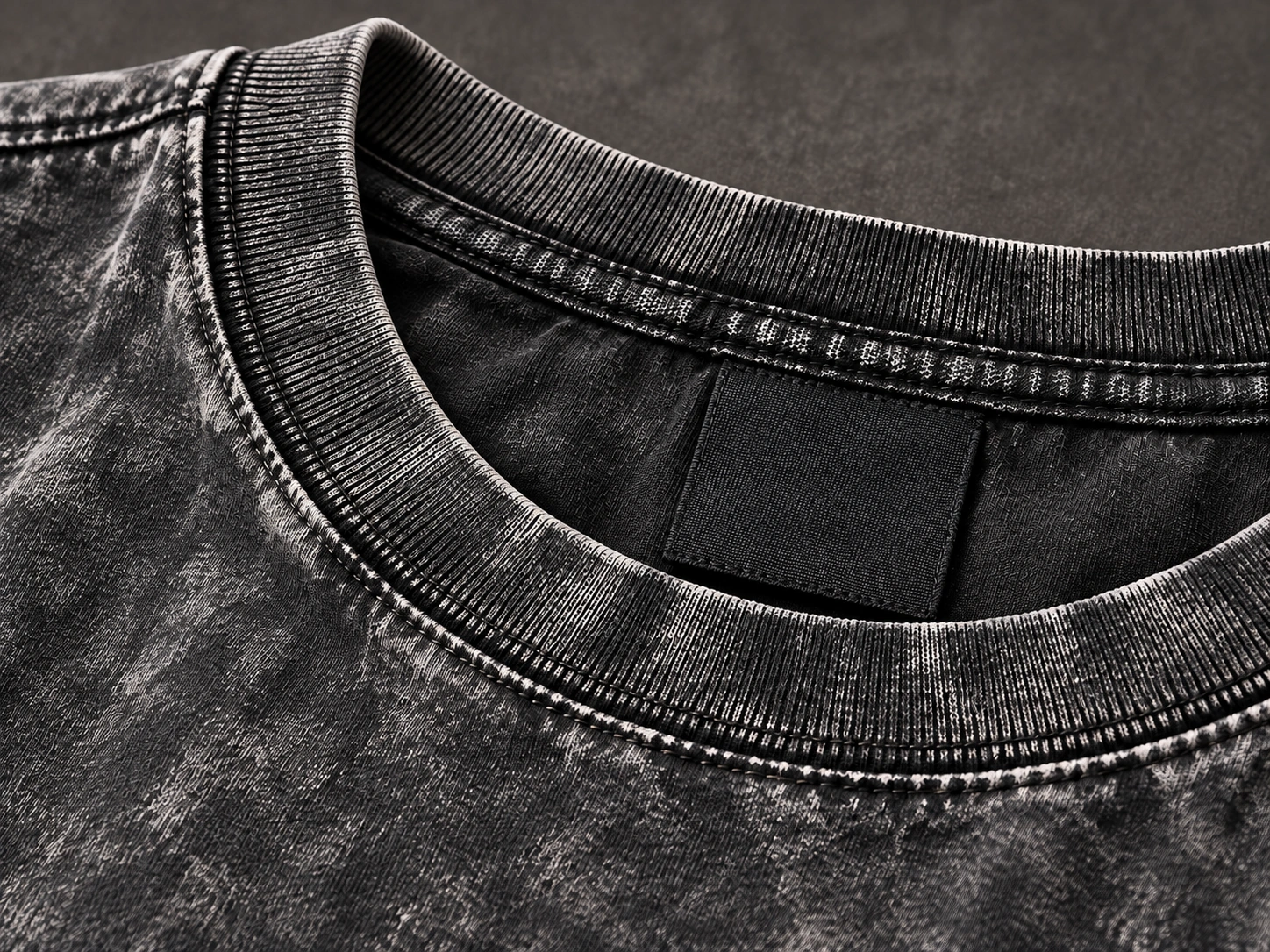 Washed T-shirt collar and seam inspected for consistent finish