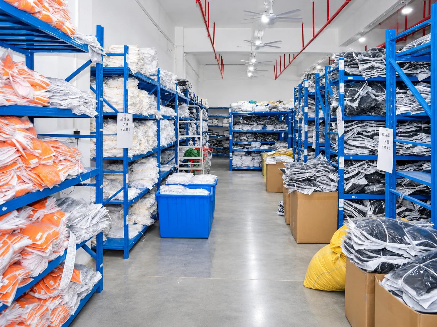 Packed garments sorted on shelving in the finished goods area.